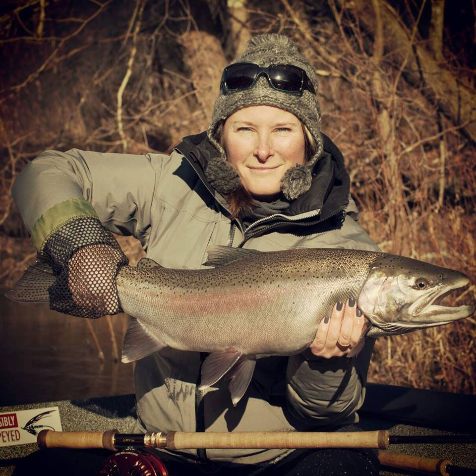 Jen Ripple holds a perfect winter Steelhead caught using a swung fly on the Muskegon River.